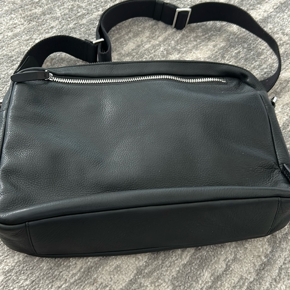 Black Ecco iPad bag
14x11
With strap 
Zippers
Has outside zipper pocket